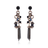 Metal dangle earrings blue stone